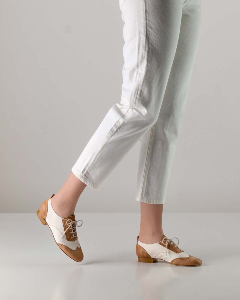 Ladies' leather dance shoe for swing in beige-white in combination with white trousers