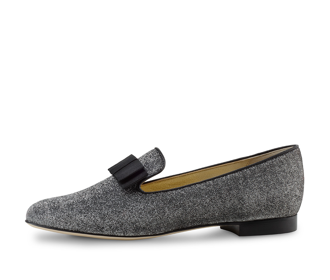 A young woman wears the Linn loafer in glitter