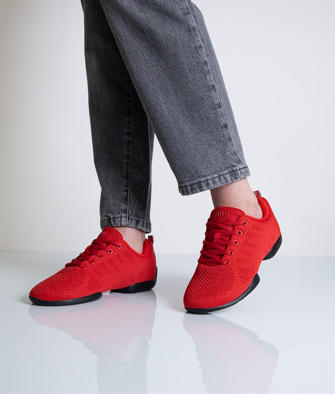 Red dance sneaker with split black sole and laces