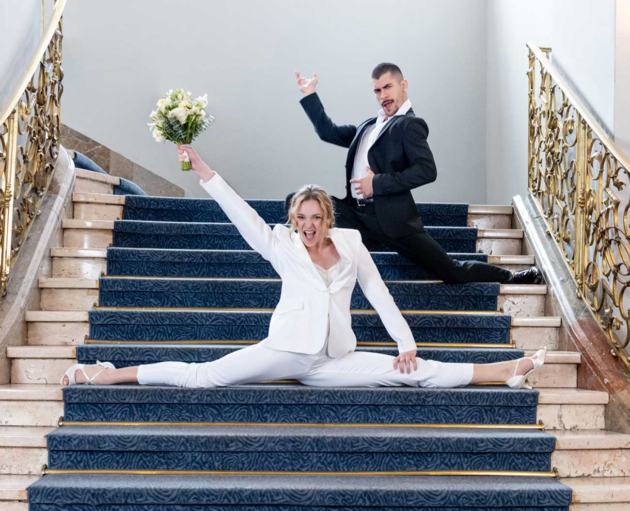 A bride does the splits on the stairs wearing Werner Kern shoes. A bride does the splits on the stairs wearing Werner Kern shoes.