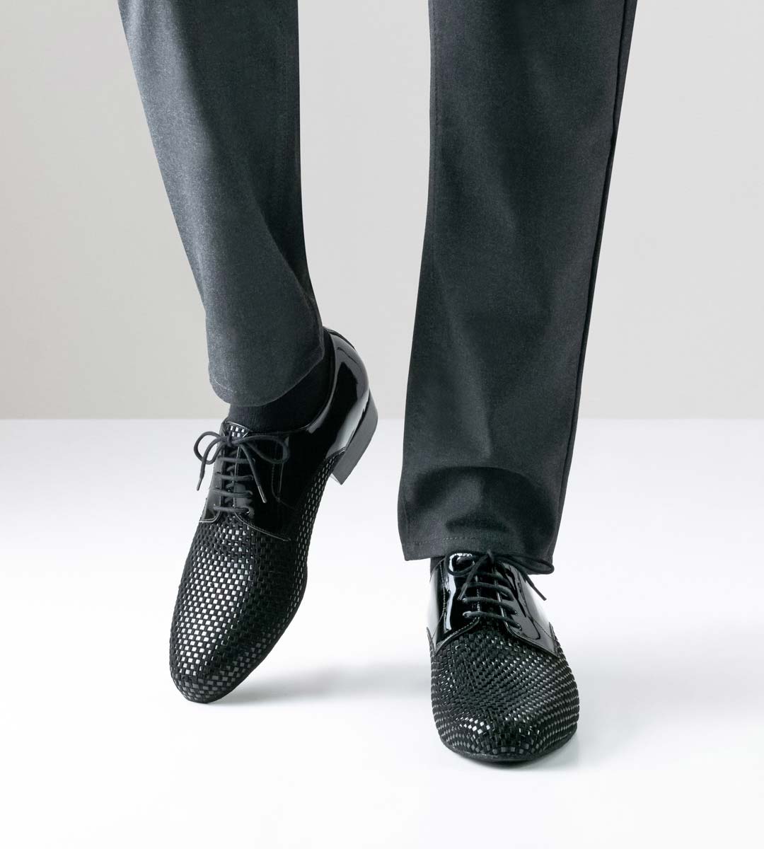 Rio Negro Nueva Epoca men's dance shoe in velour and patent combined with grey trousers