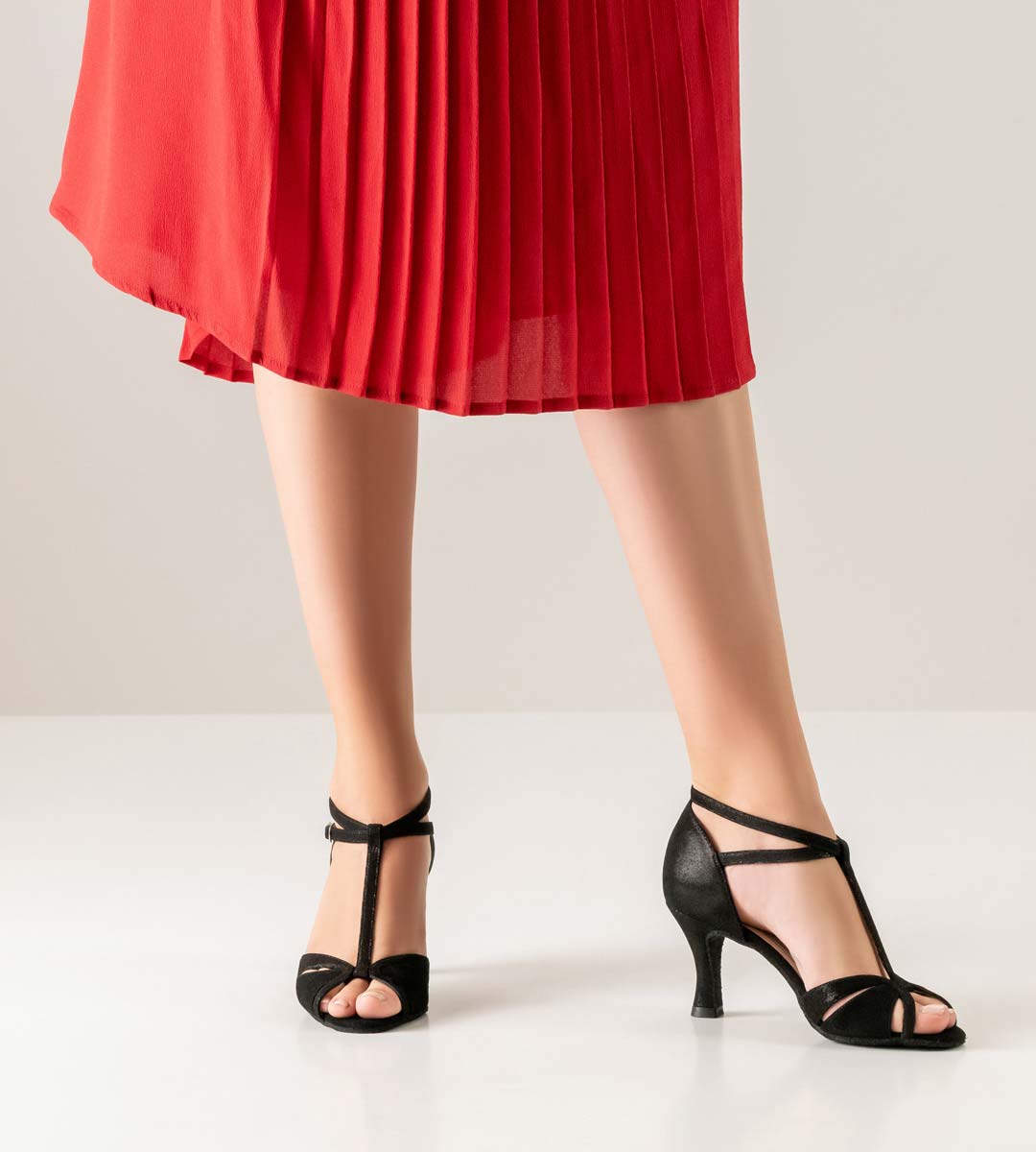 Ida T-bar ladies' dance shoe combined with red pleated skirt