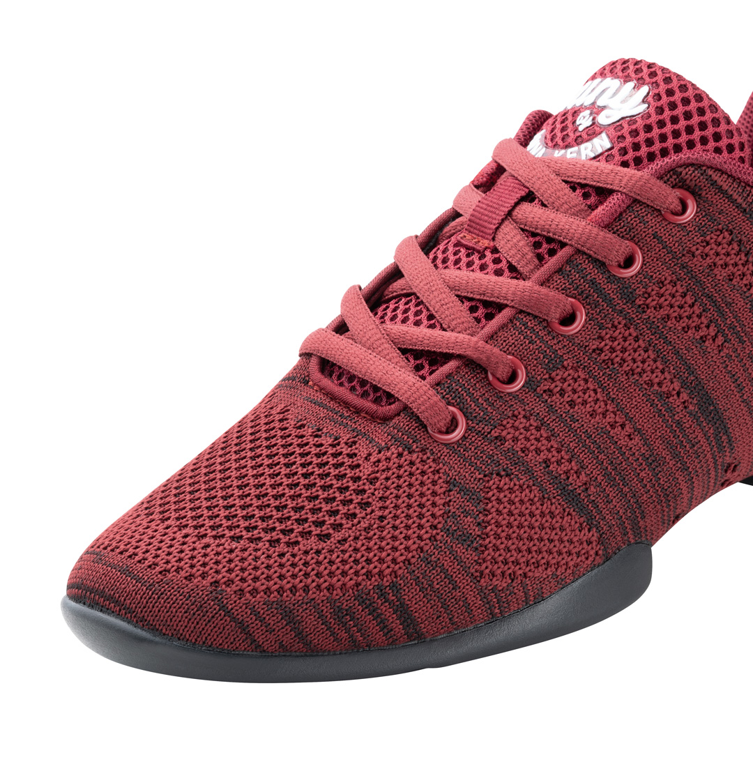Detailed view of the red women's dance sneaker by Suny
