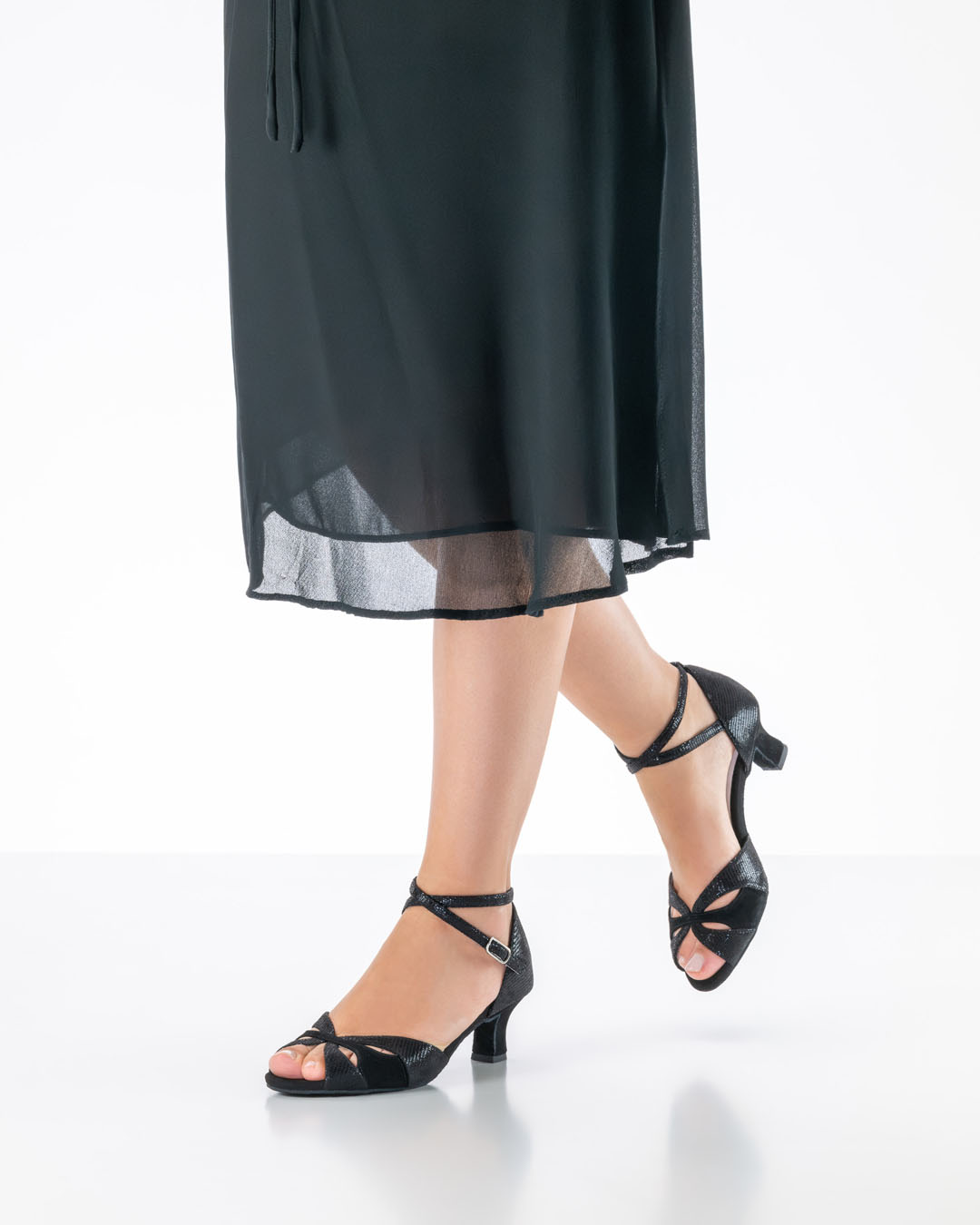 Eunice dance sandals worn with a black dress