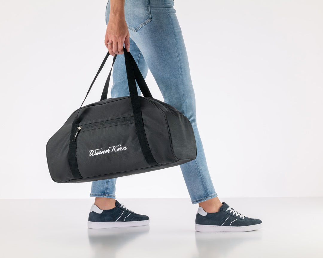 Product image of a black sports bag with white, embroidered Werner Kern logo lettering