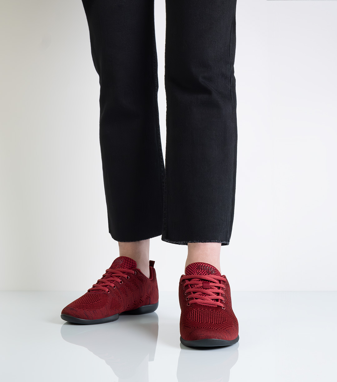 Red, lightweight women's dance sneaker with five-hole lacing by Suny