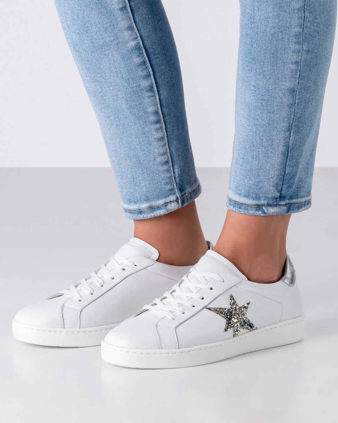 White leather dance sneakers by Werner Kern with silver star on the side