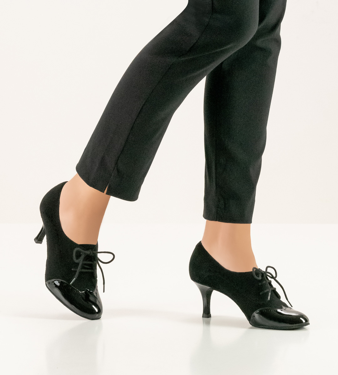 Black trousers in combination with black Nueva Epoca ladies' dance shoe