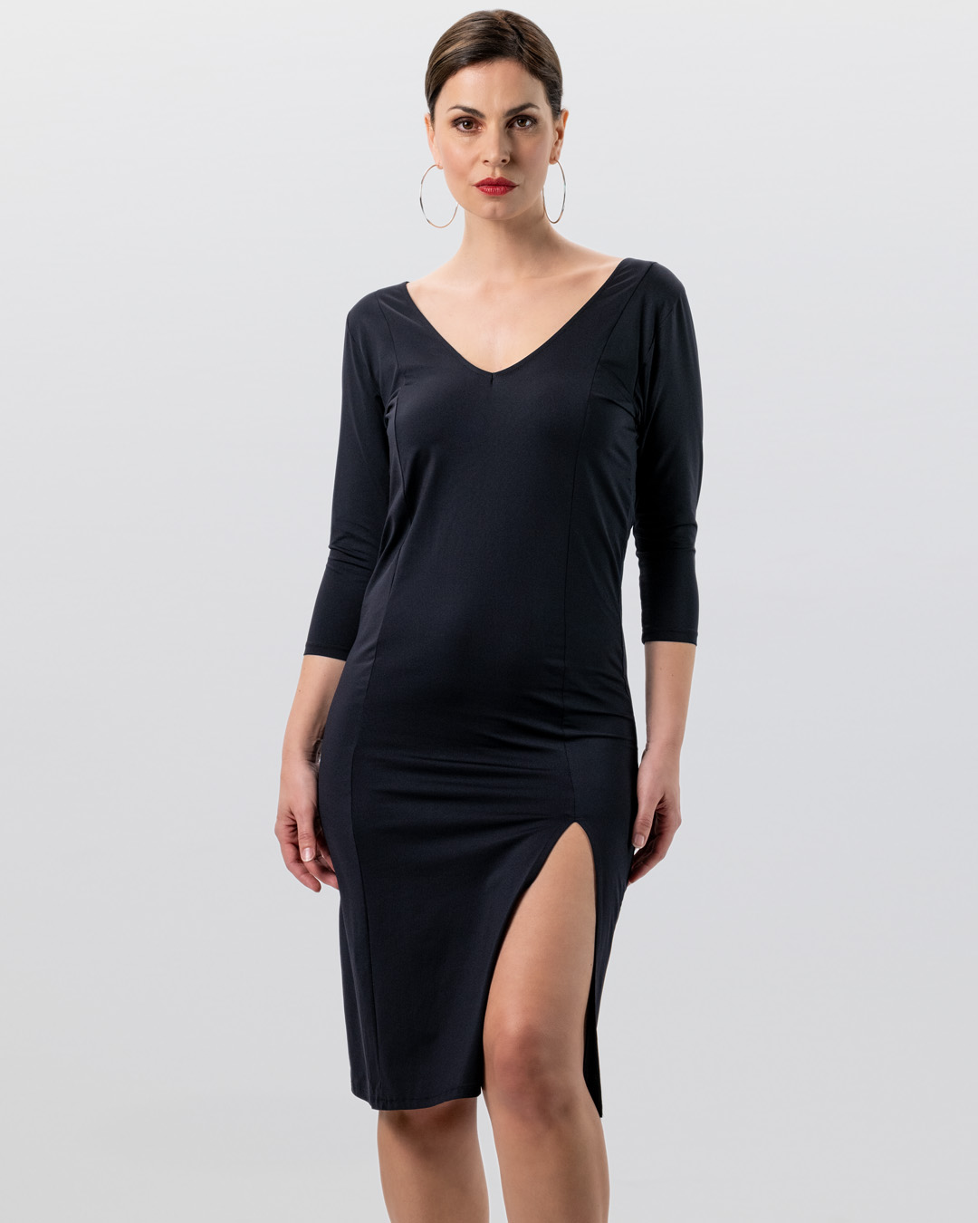 Long-sleeved, slim-fit, knee-length dance dress made from stretchy material with a slit at the leg by Werner Kern