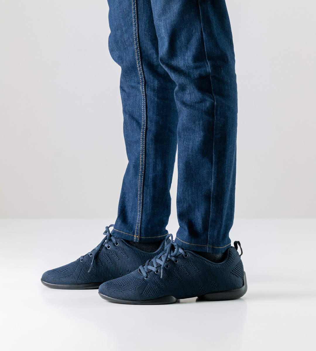 Blue men's dance sneaker in combination with blue jeans