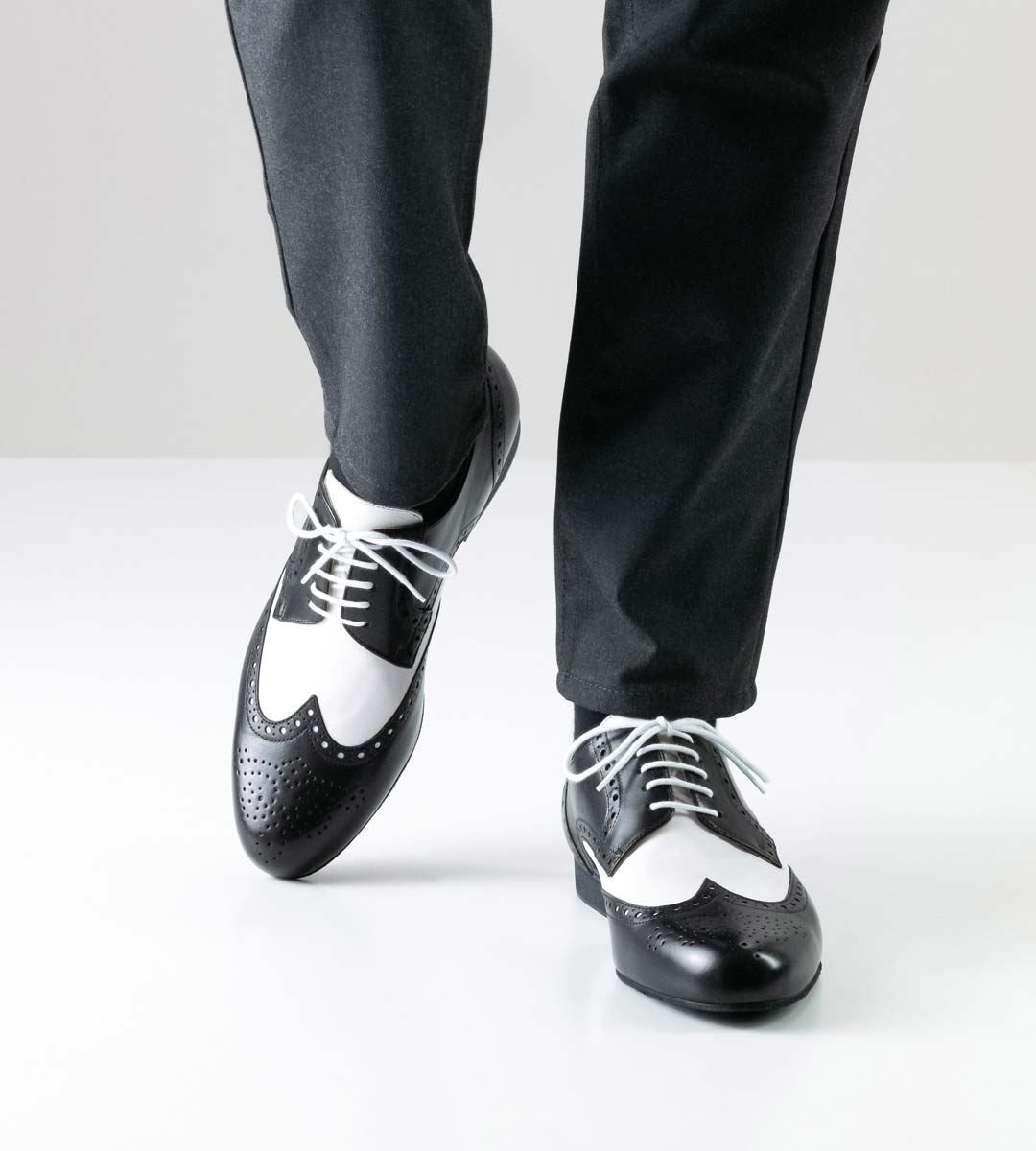 Udine black and white men's dance shoe for tango by Werner Kern in combination with grey trousers