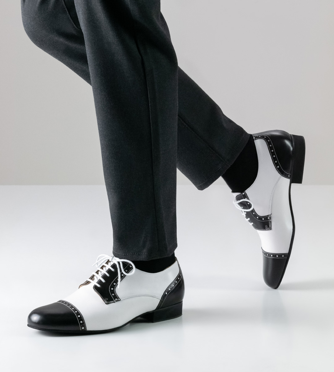 black and white men's dance shoe by Werner Kern in combination with grey trousers