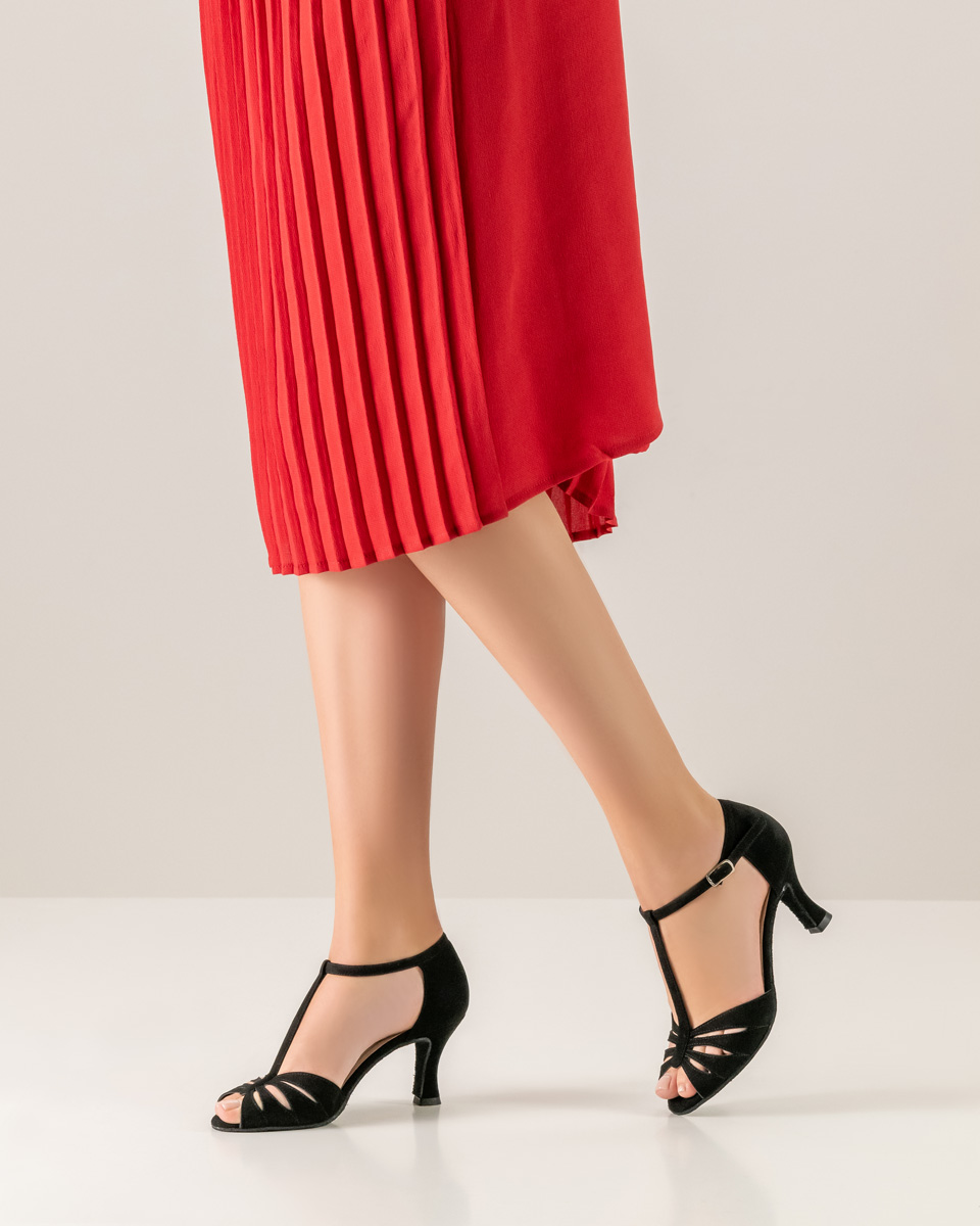 Red pleated skirt in combination with black Werner Kern ladies' dance shoe