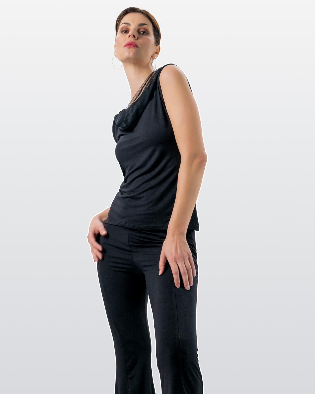 Model poses in Auri dance top and Nisha dance trousers by Werner Kern