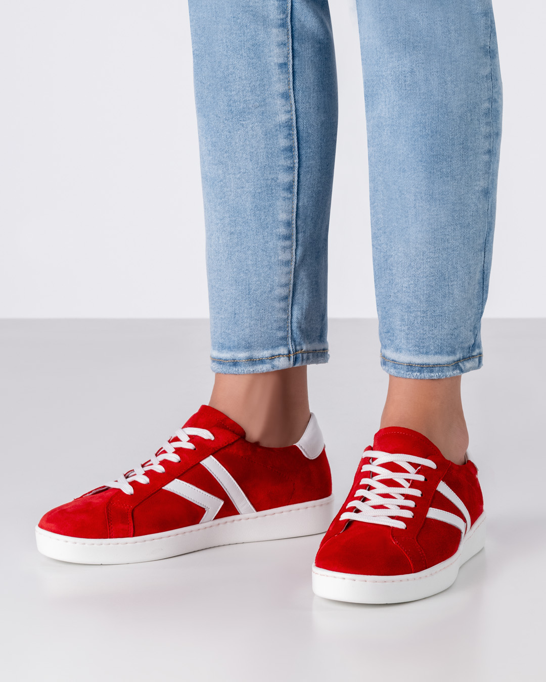 Red dance sneaker with white details and slightly rotating PU sole in white by Werner Kern