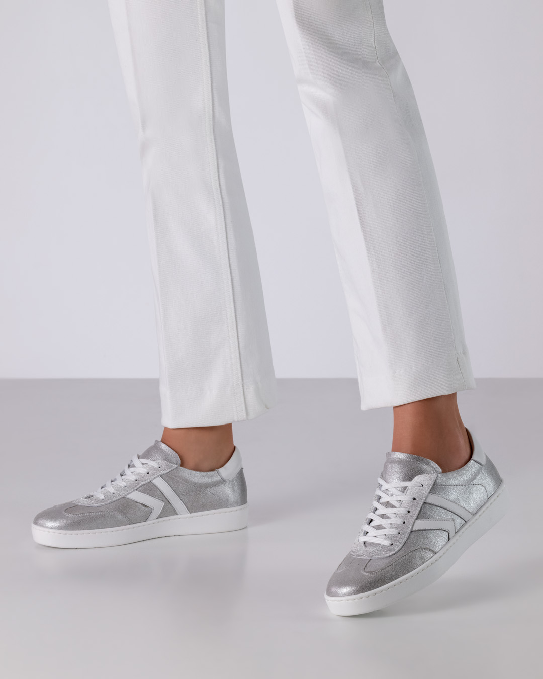 Matt silver shimmering leather dance sneakers by Werner Kern with white details and white soles