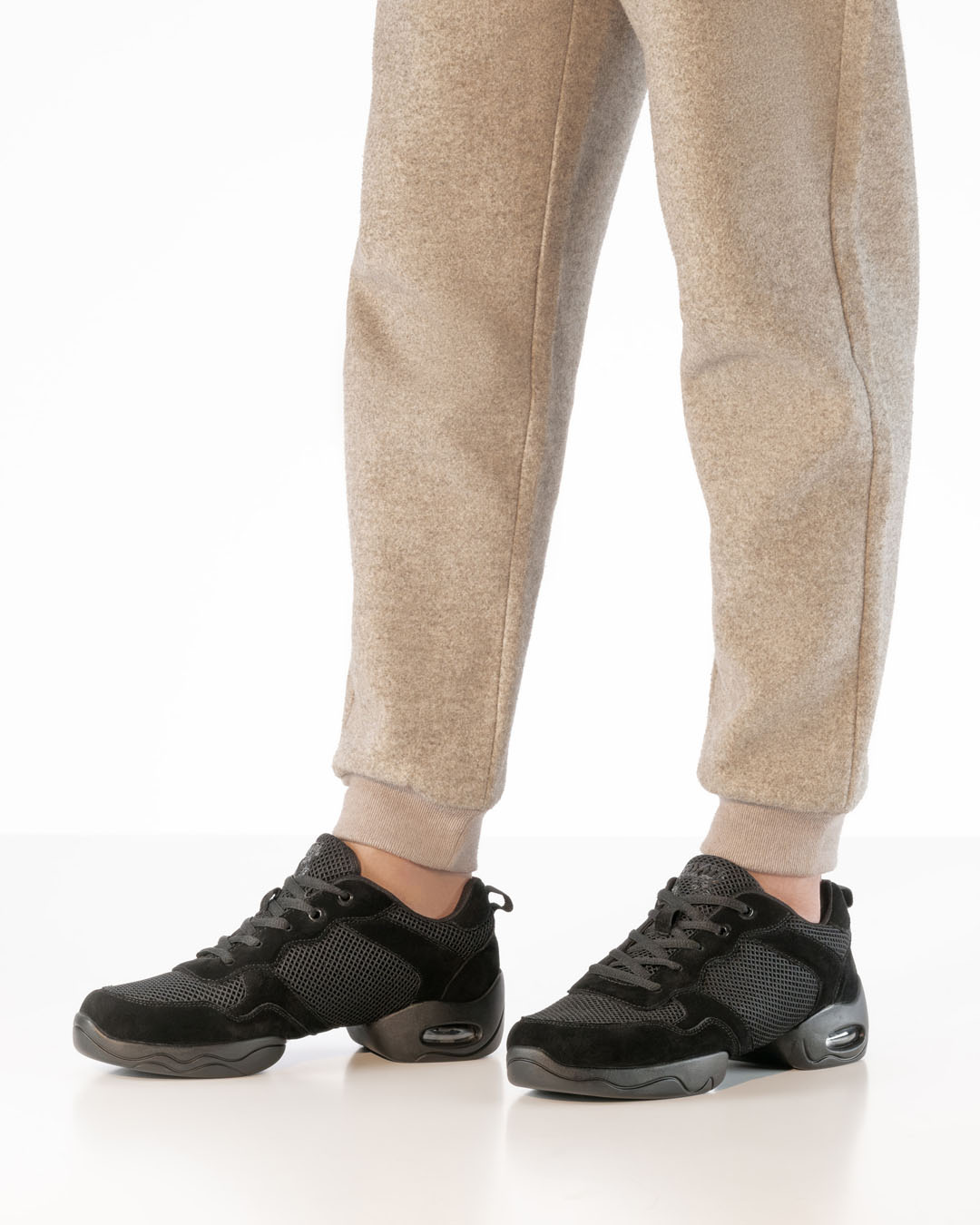 Black dance trainers with a split sole in a chunky style, made from leather and mesh, by Werner Kern