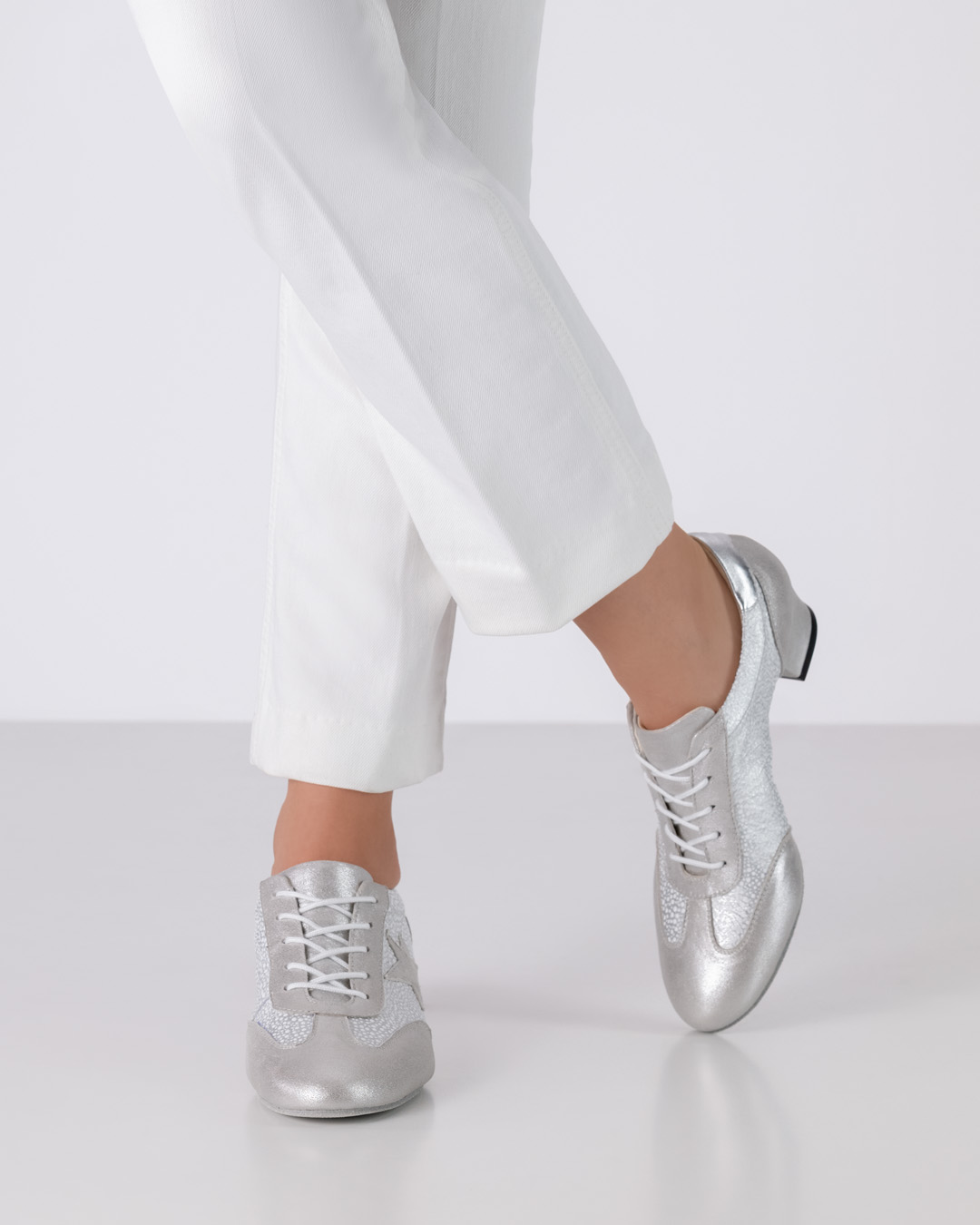 Elegant training dance shoe in a sneaker look with a small heel and laces in silver by Werner Kern