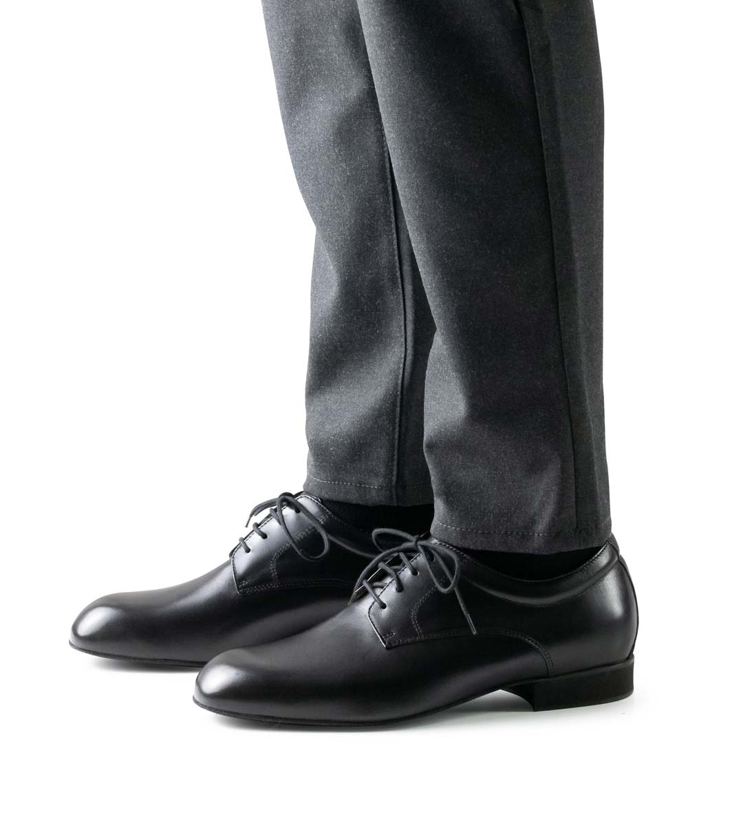 Padua black men's dance shoe with 2 cm high heel in combination with trousers in grey