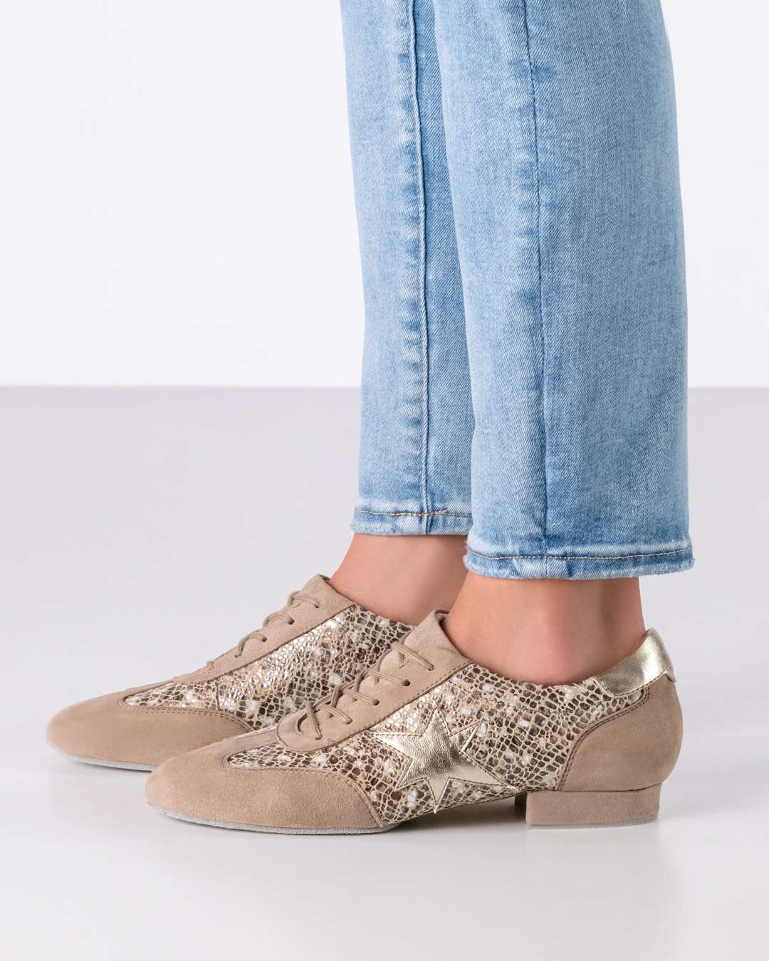 Dance training shoe in sneaker design with flat sole and golden star detail