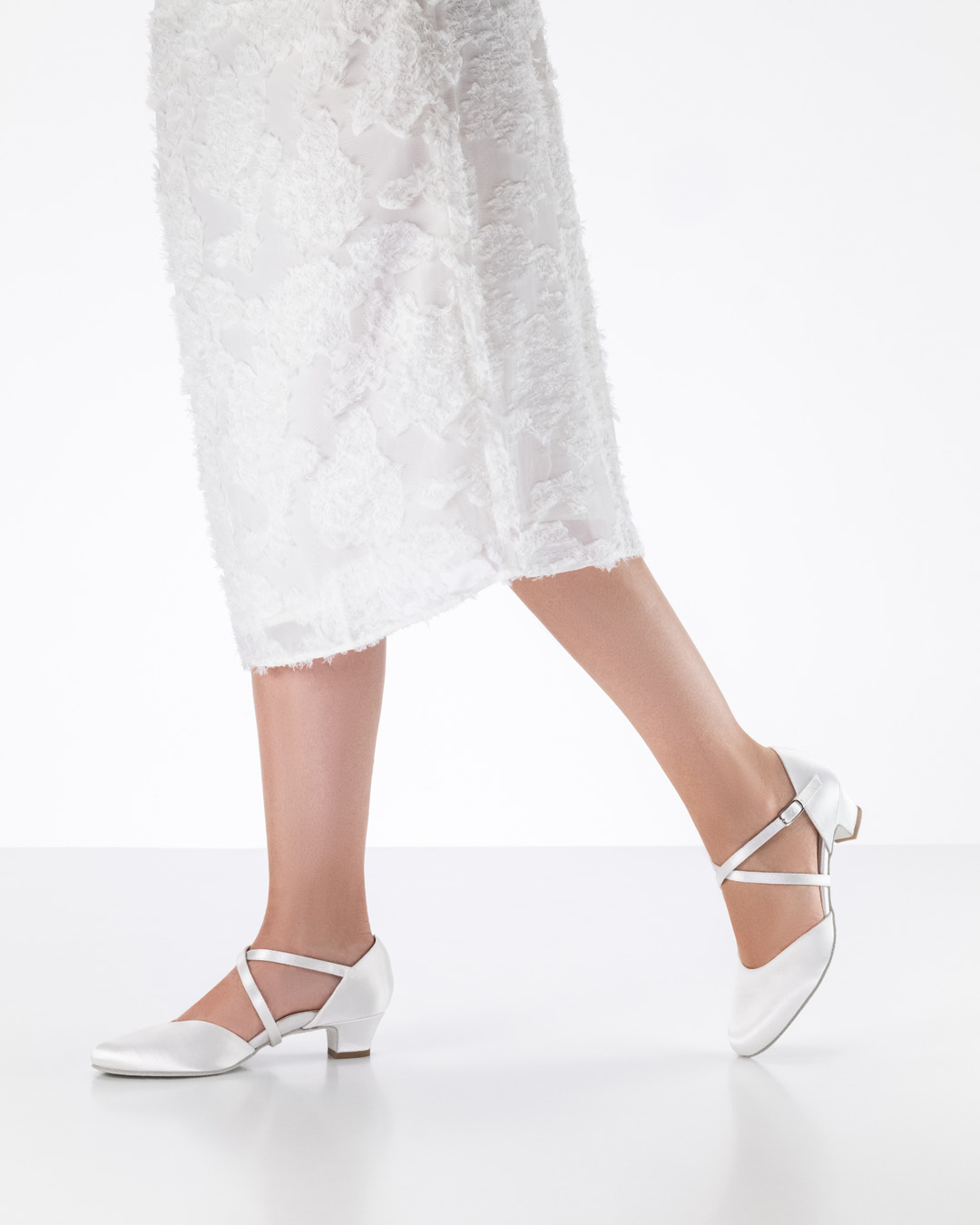 Satin bridal shoe by Werner Kern in combination with white dress