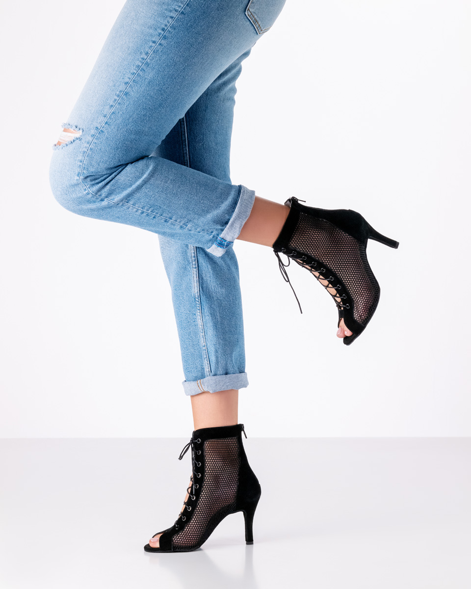 Black dance shoe combined with casual blue jeans.