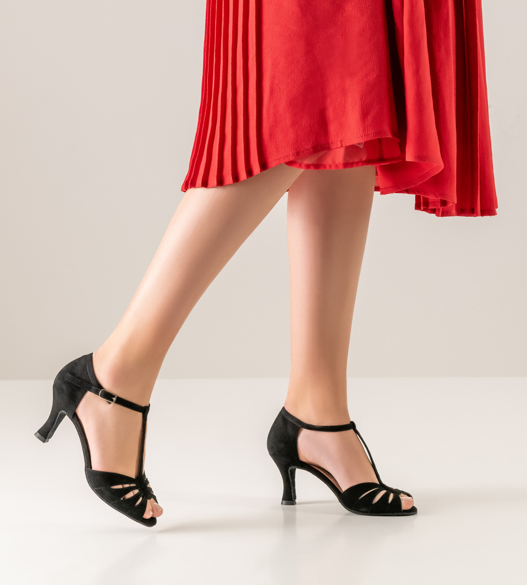 Werner Kern T -bar ladies' dance shoe in combination with red pleated skirt