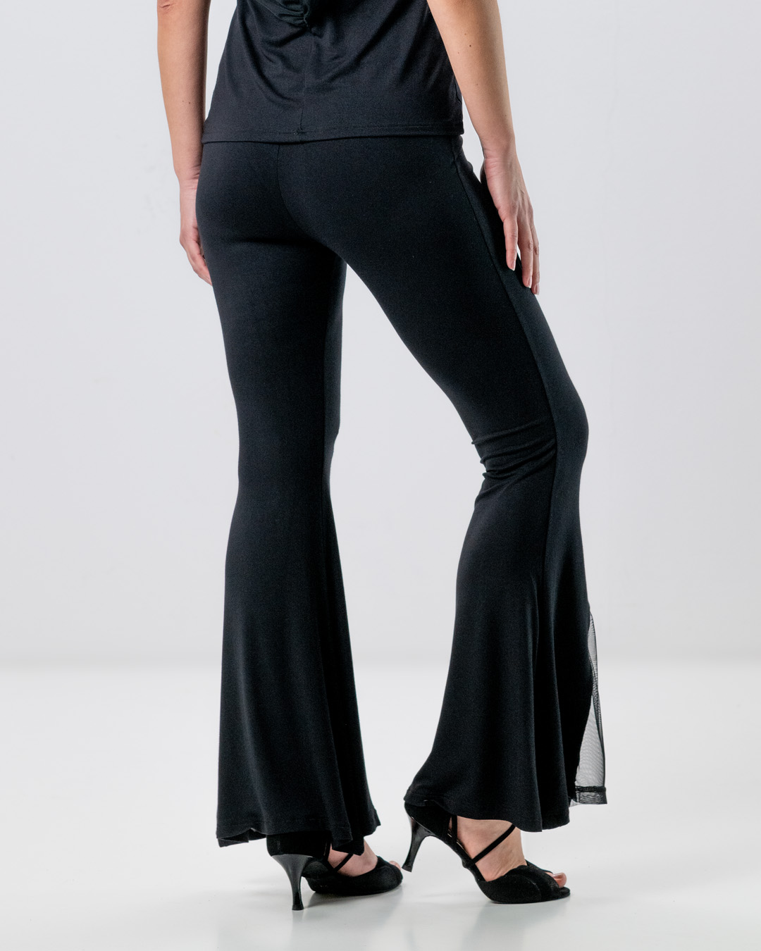 Rear view of dance trousers by Werner Kern in black with flared legs and tulle insert