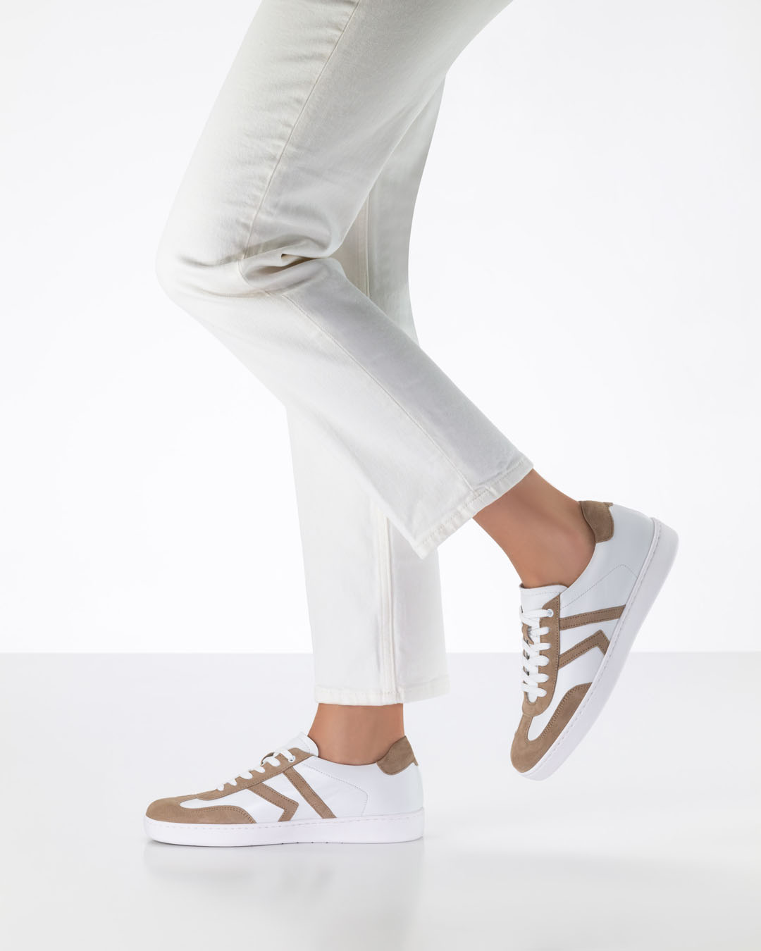 Women’s dance trainers by Werner Kern in white with beige detailing, worn with white jeans