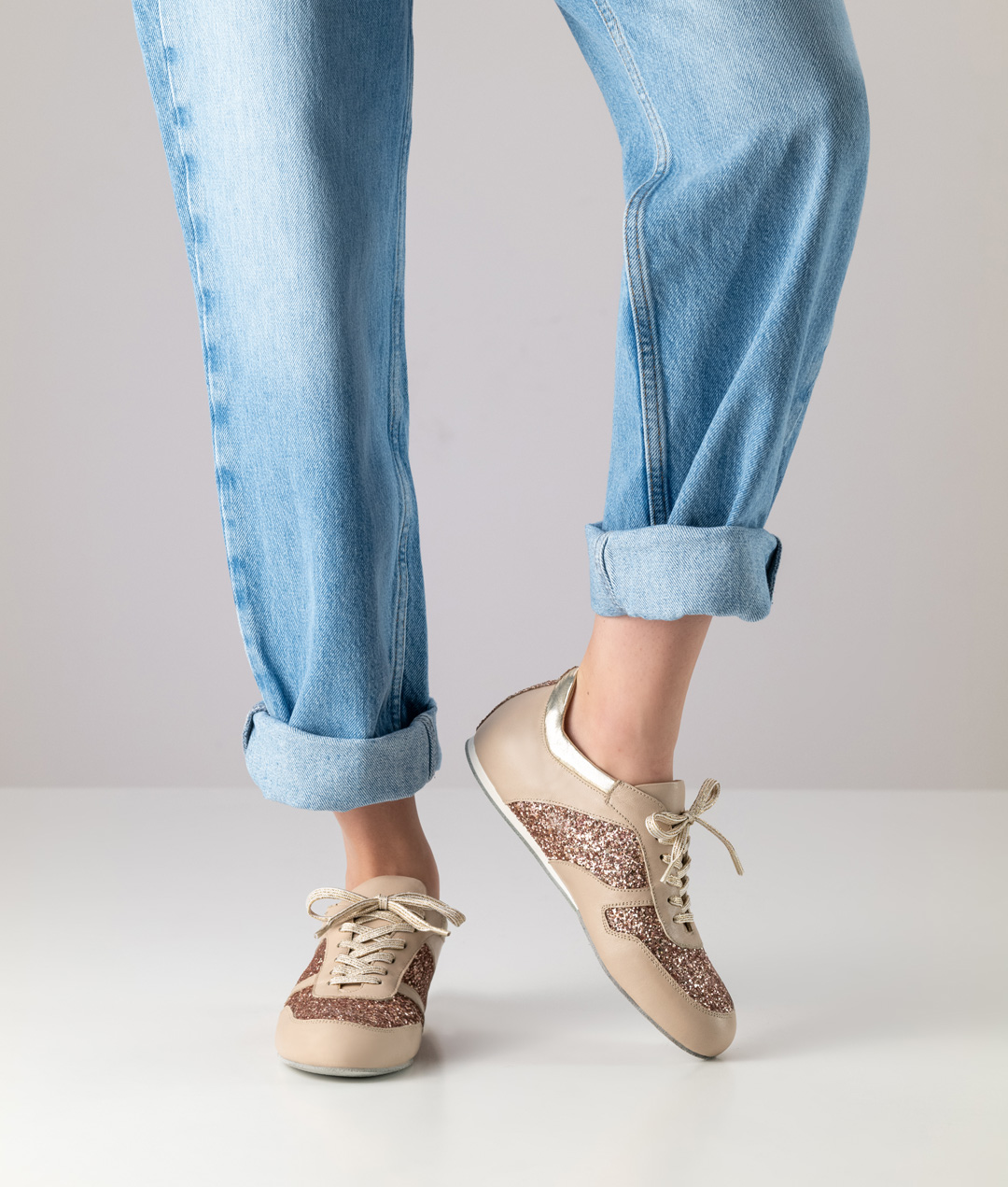 Flat dance sneakers with suede sole by Werner Kern in glittering brocade in rose gold and beige details.