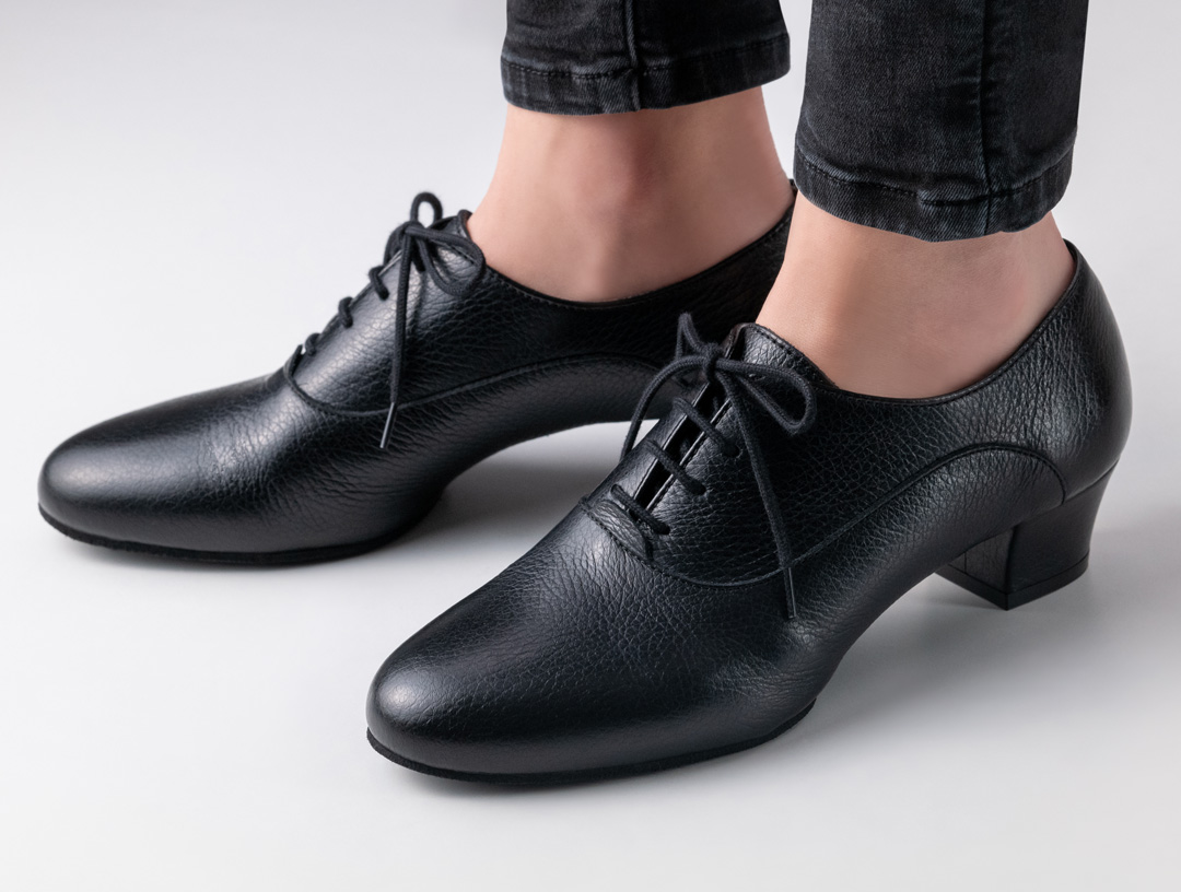 Black, closed lace-up dance shoe made from fine deerskin and a small comfort heel.