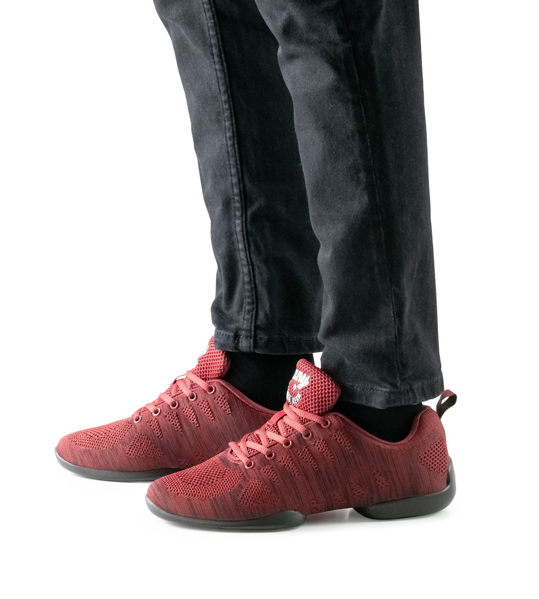 Black trousers in combination with red men's dance sneaker by Suny