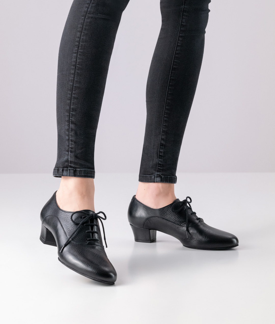 Classic lace-up dance shoe made from deerskin with a small block heel.