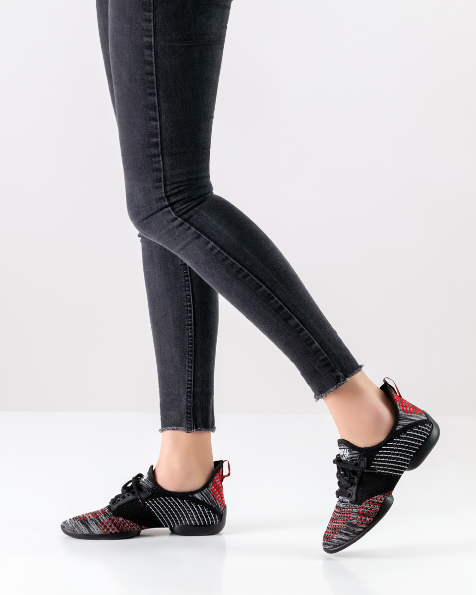 Bachata ladies dance sneakers by Suny in combination with black trousers