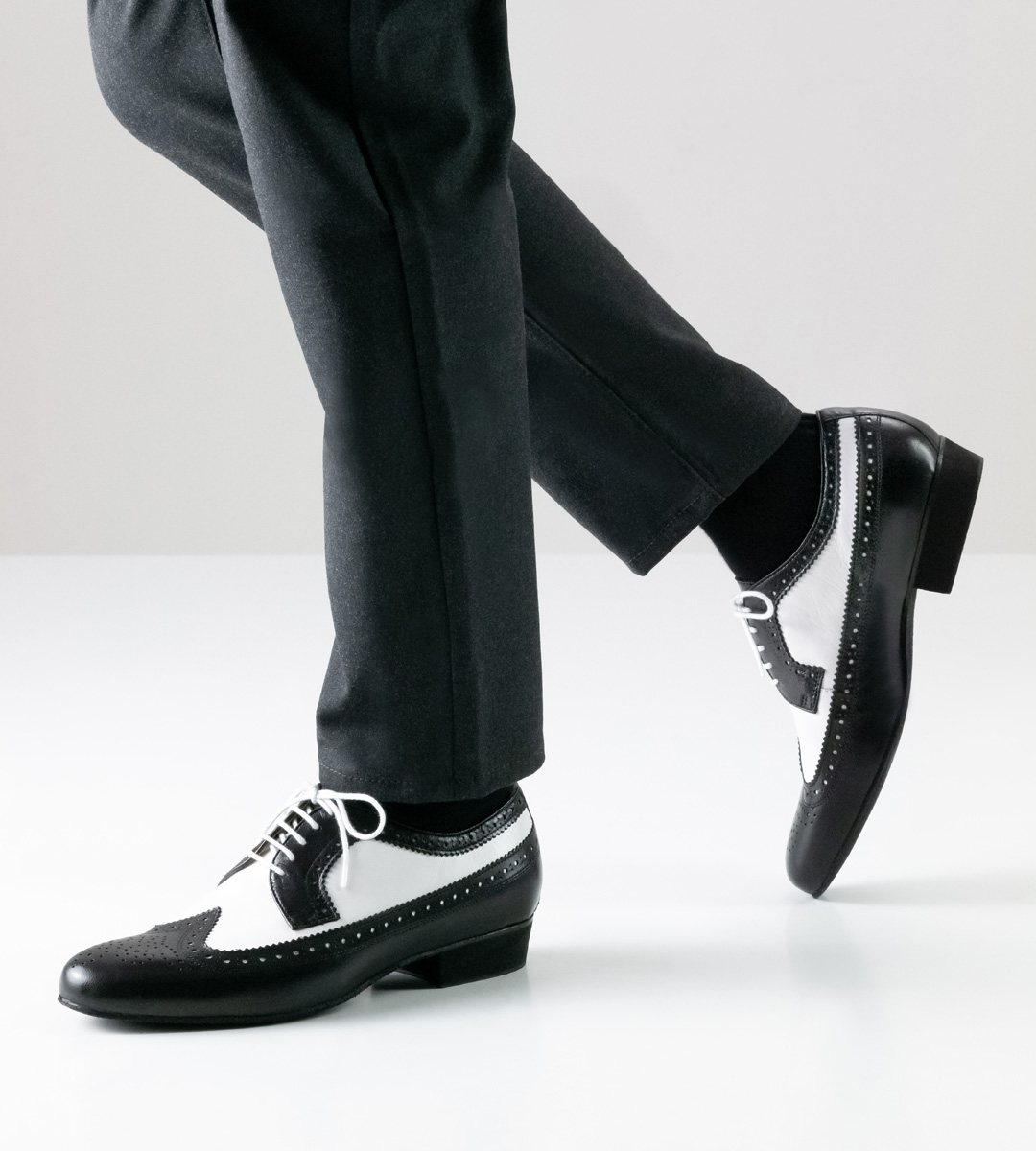 Nueva Epoca men's dance shoe in front view in combination with black jeans
