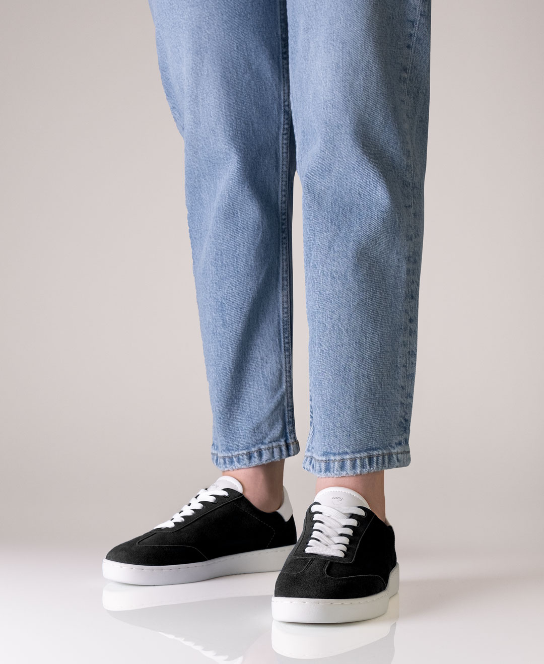 Black suede sneaker with white lacing for women