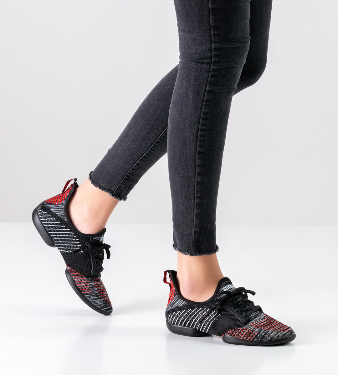 Black trousers in combination with women's dance shoe sneakers by Suny