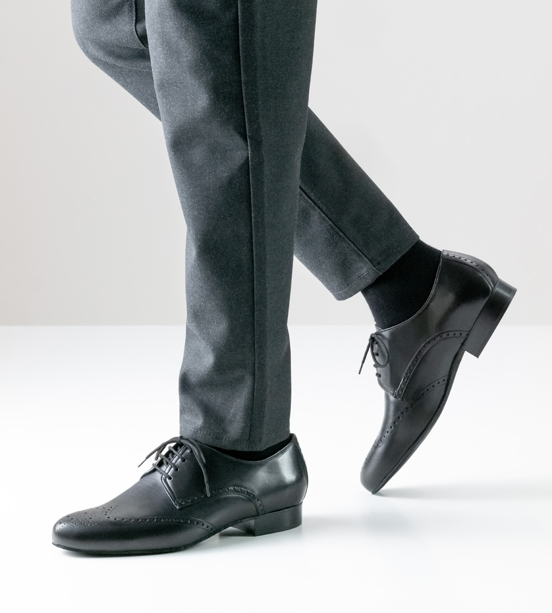 Anna Kern men's dance shoe in black leather combined with grey trousers