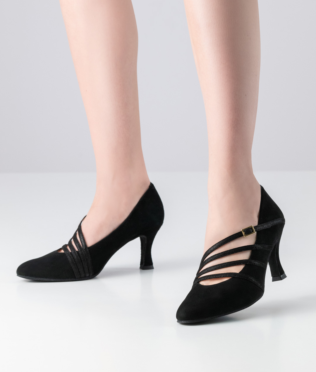 Black dance shoe in pump shape made of supple suede with straps and flare heel