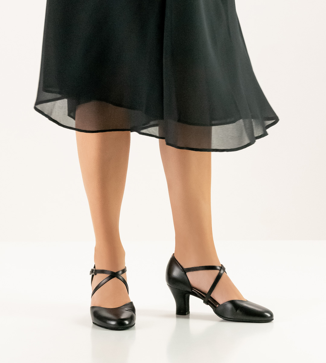 Comfortable Werner Kern ladies' dance shoe in combination with black skirt