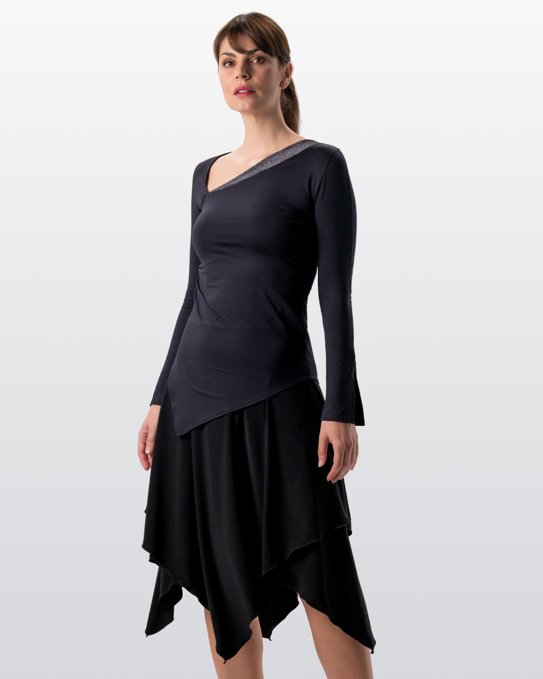 Model poses in dance outfit by Werner Kern with Orla dance skirt and Rida dance top in black.